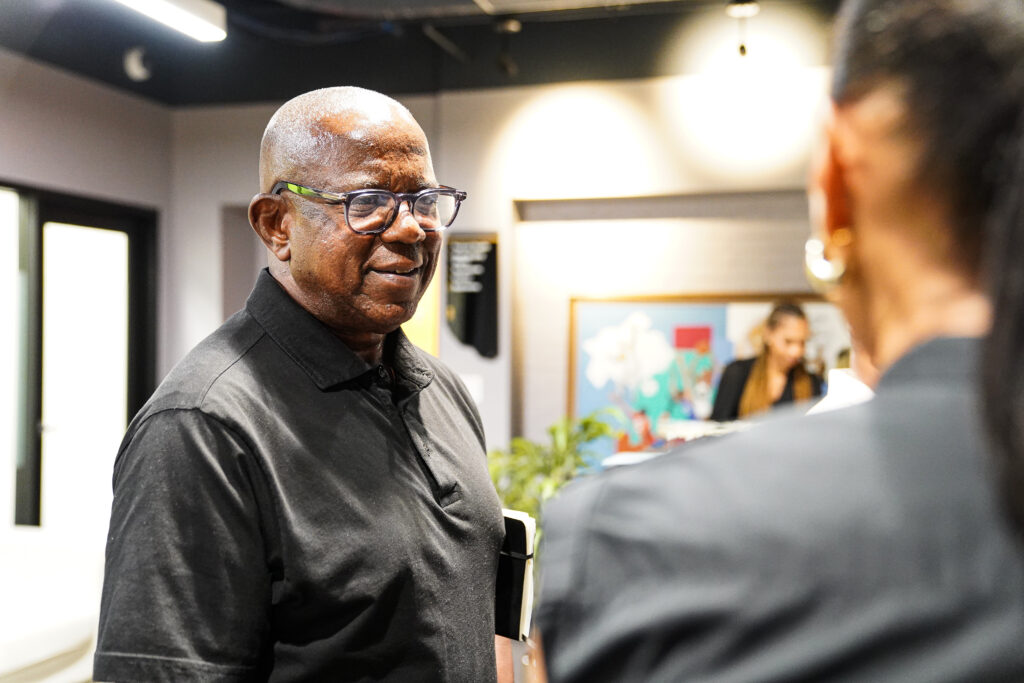 RICE Board Member Jermone Russell, Jr. speaks with Stakeholders
